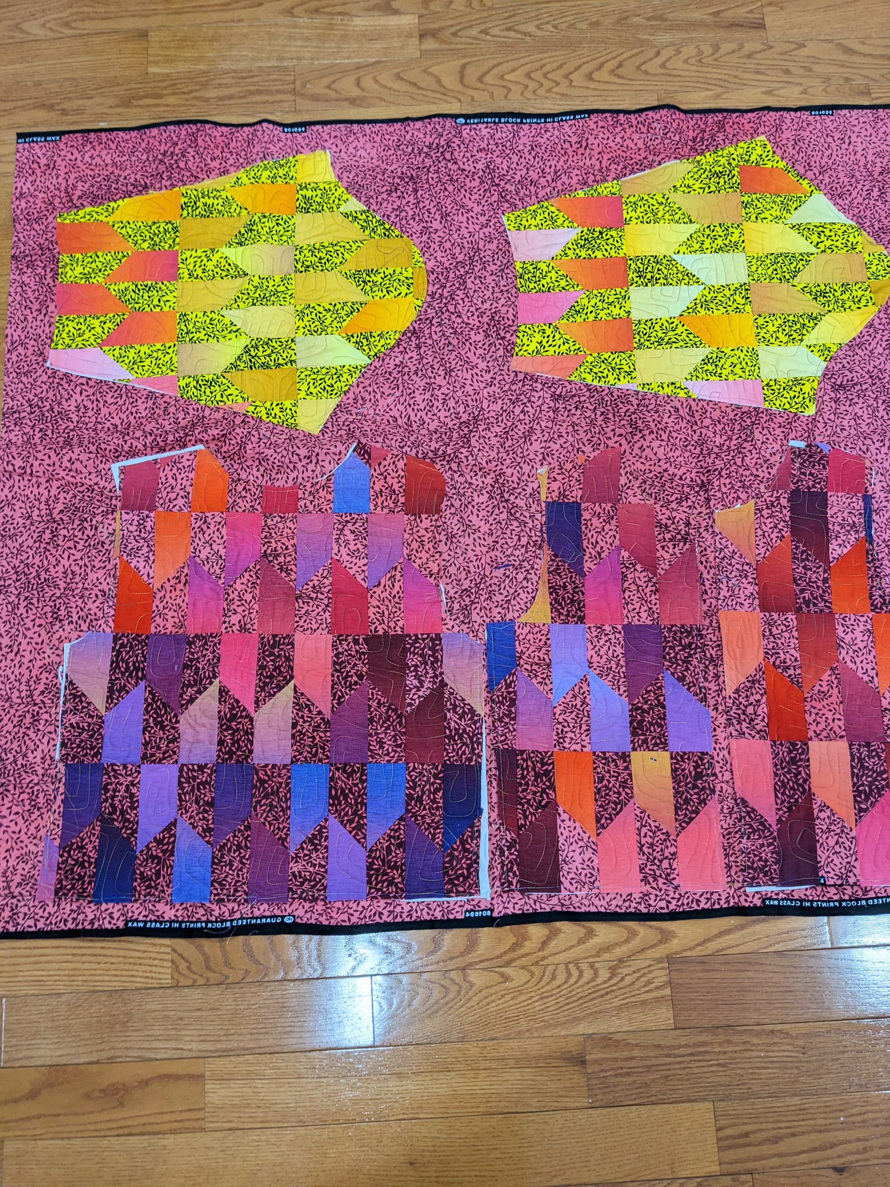 quilted fabric cut into clothing pattern pieces